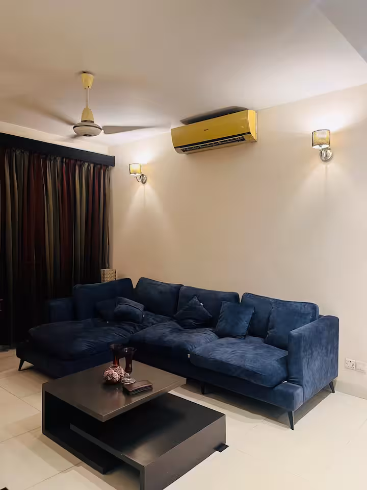 Comfortable blue sofas in the Banani living room